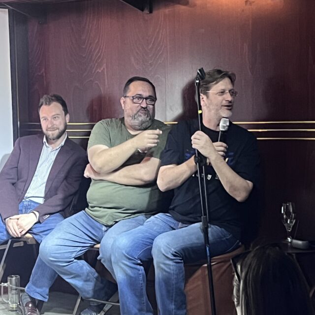 Three comedians seated on stage at a No Offense, But... show